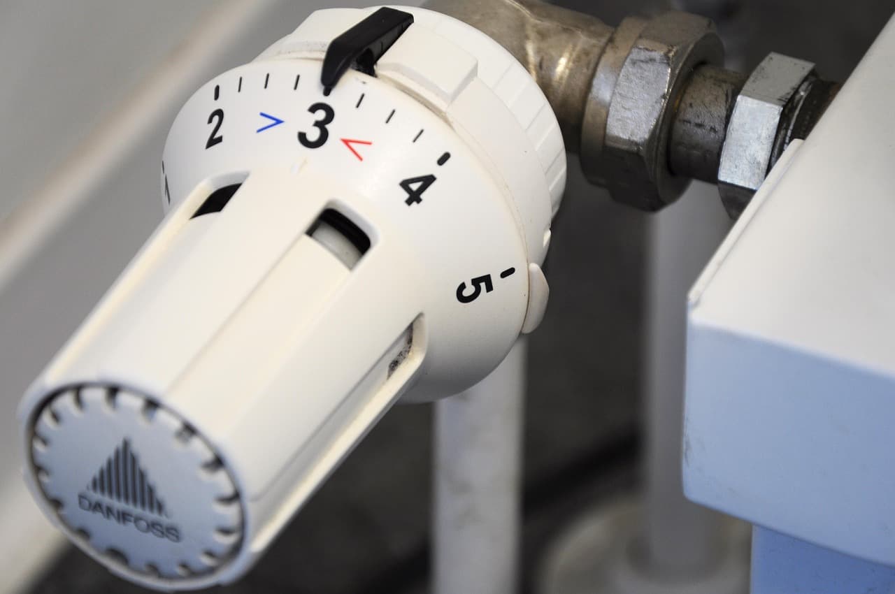 Thermostatic radiator valve on a white radiator