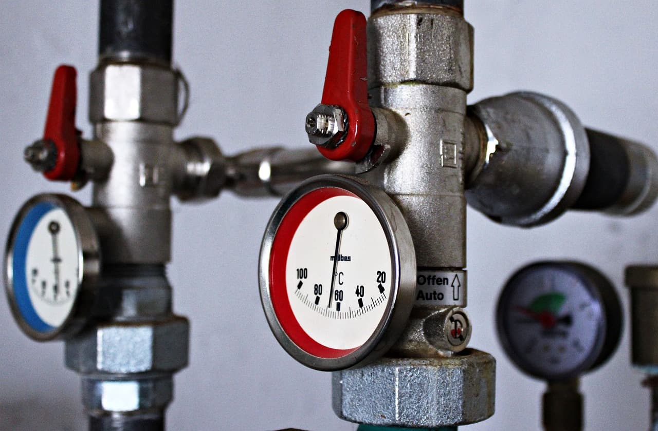 Heating system pressure gauges and red isolation valves
