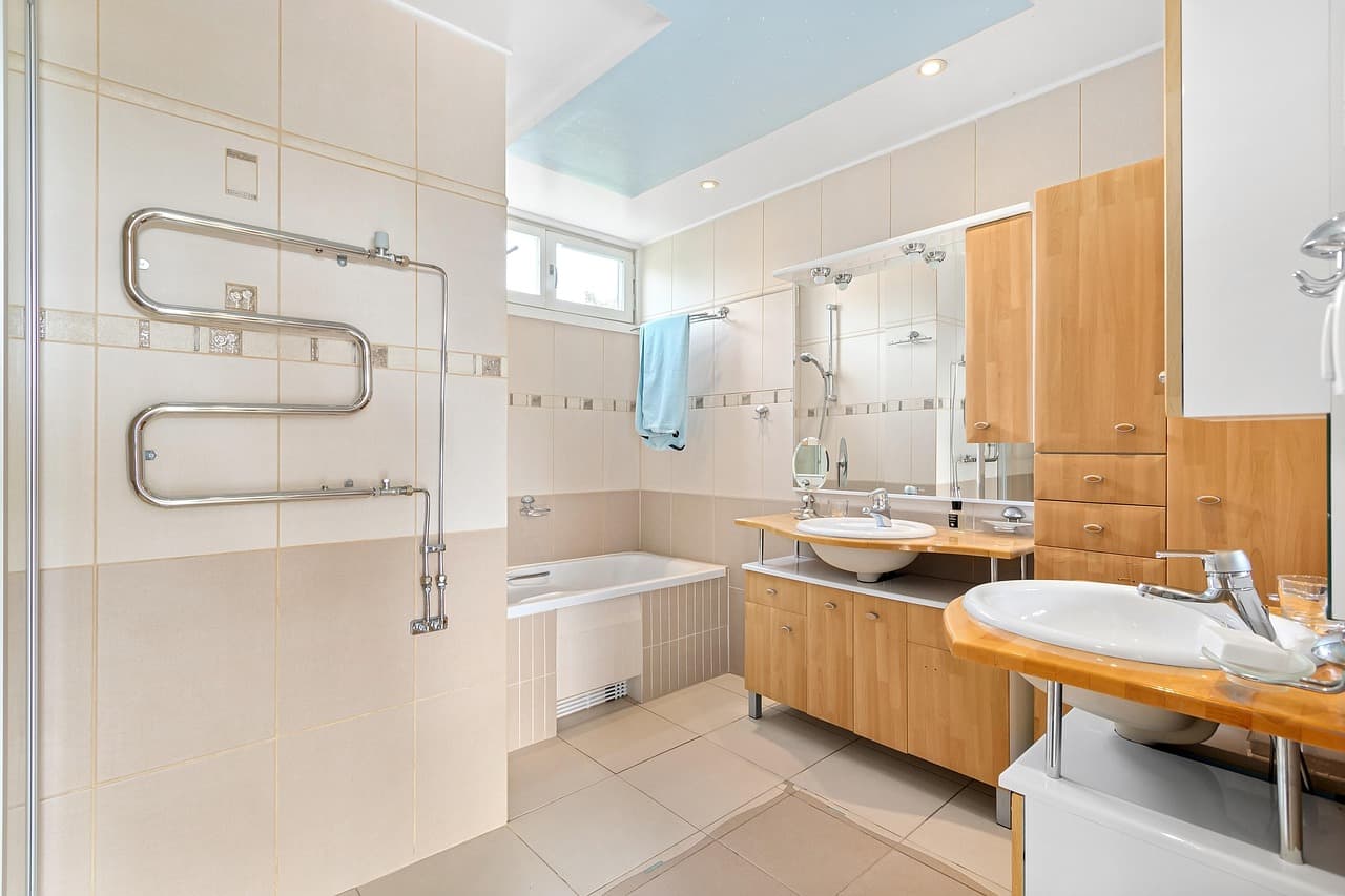 Bright fitted bathroom with a heated towel rail